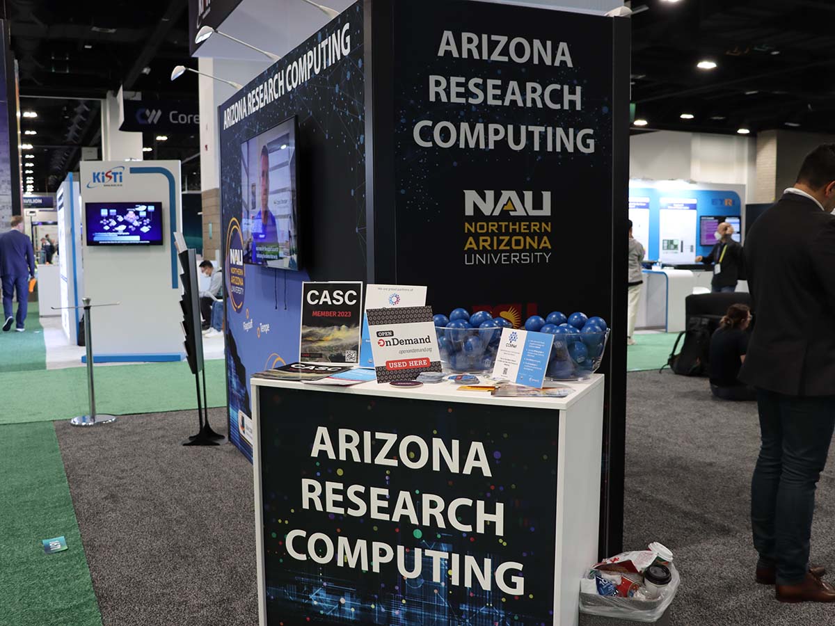 Northern Arizona University booth at SC23 with Open OnDemand placard