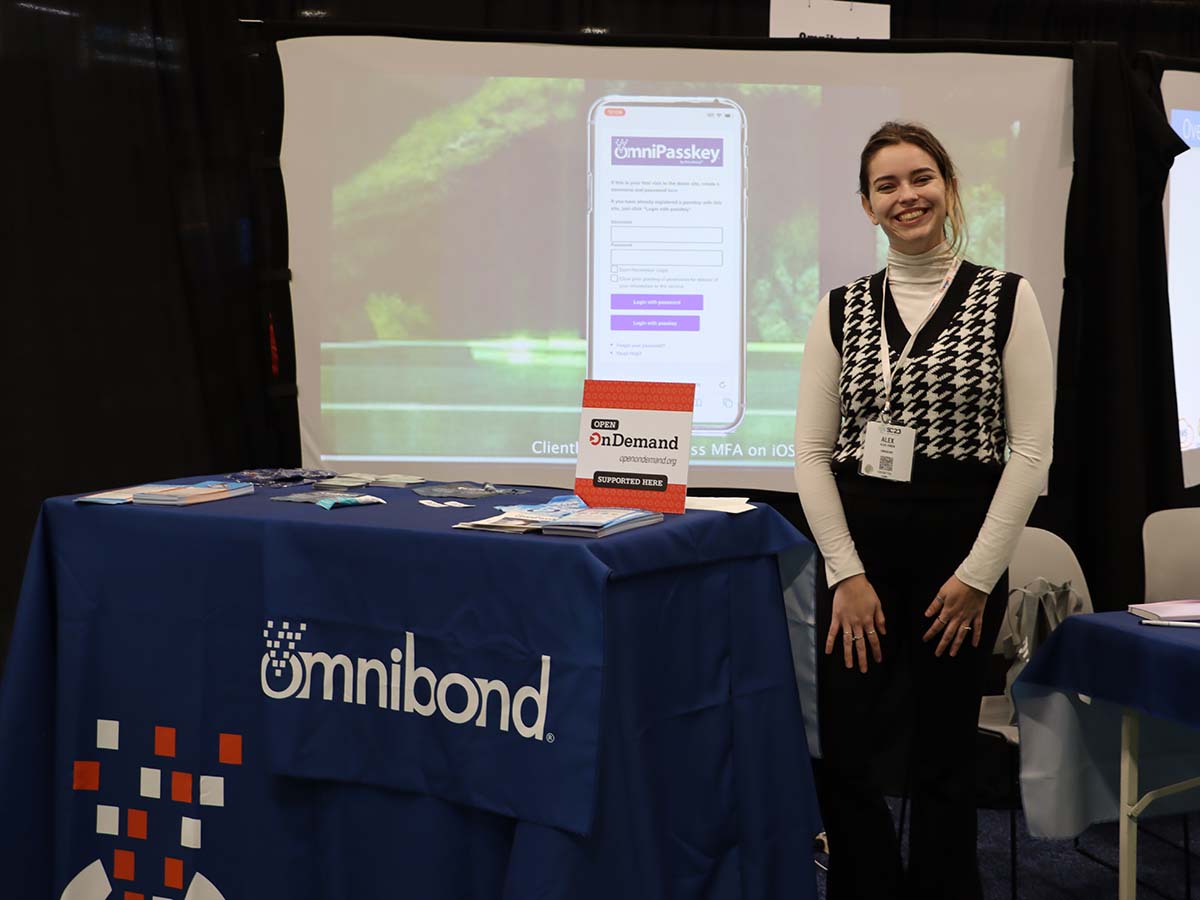 Omnibond booth at SC23 with Open OnDemand placard