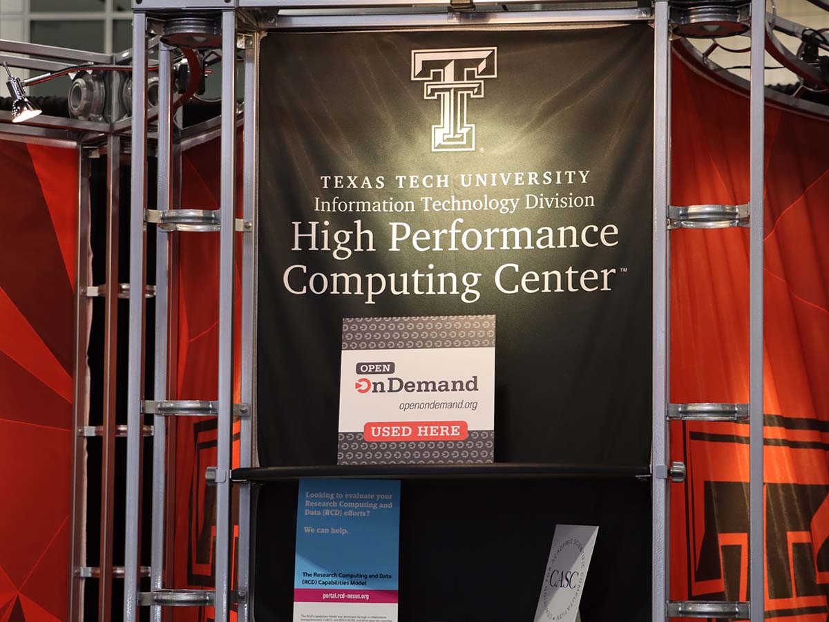 Texas Tech booth at SC23 with Open OnDemand placard
