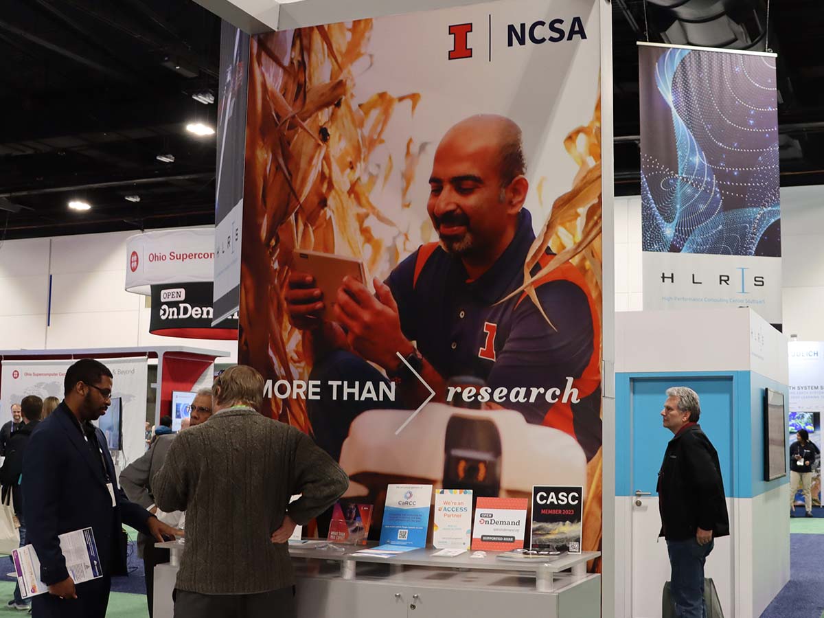 University of Illinois NCSA booth at SC23 with Open OnDemand placard