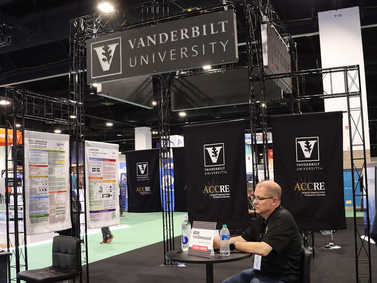 Vanderbilt University booth at SC23 with Open OnDemand placard