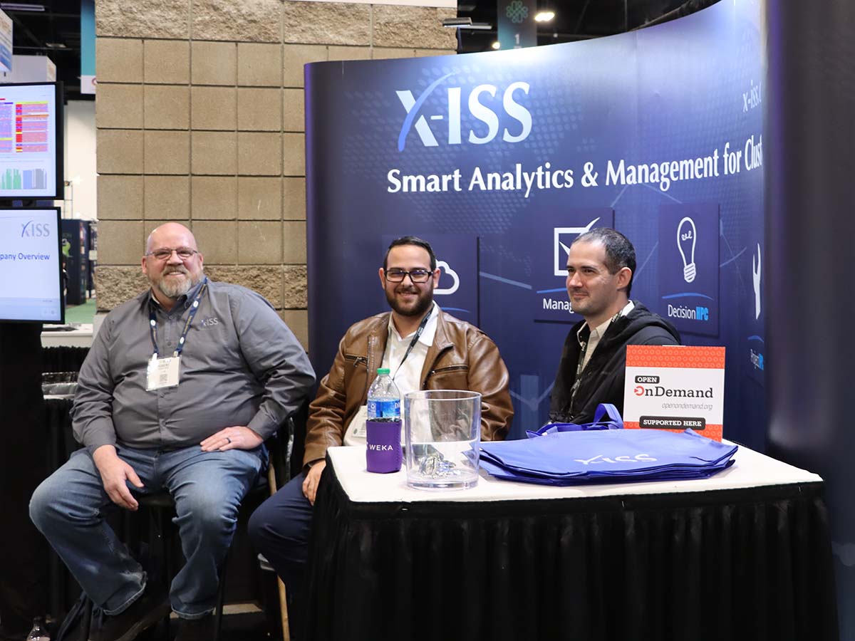 X-ISS booth at SC23 with Open OnDemand placard